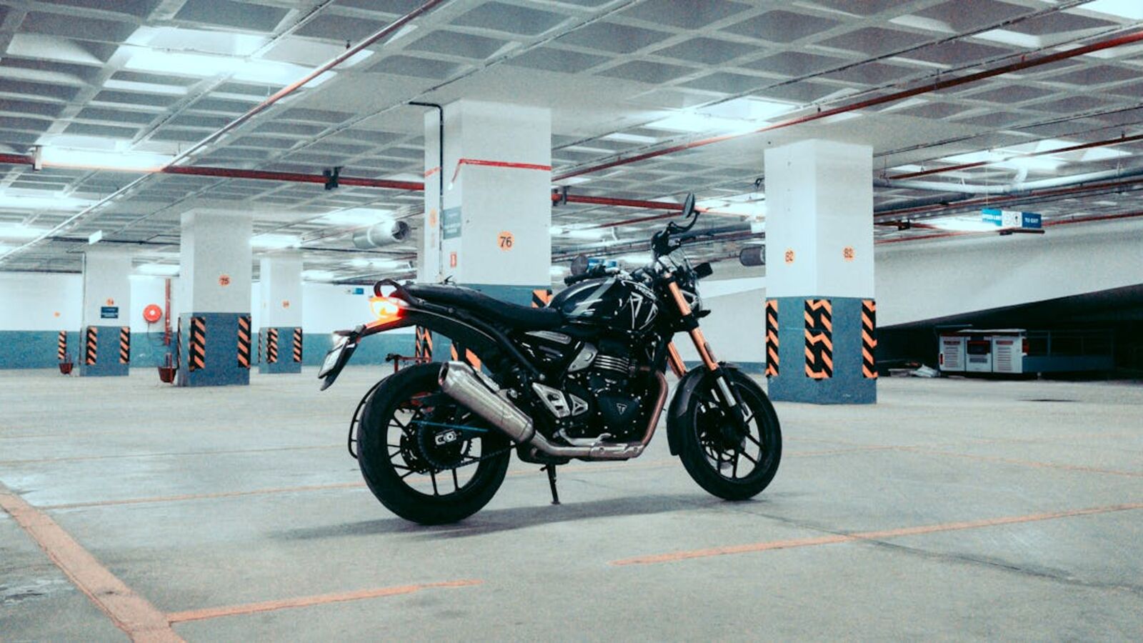 Кейс: срочная продажа мотоцикла с пробегом в Санкт-Петербурге — A sleek motorcycle parked in a spacious underground garage, capturing urban adventure vibes.